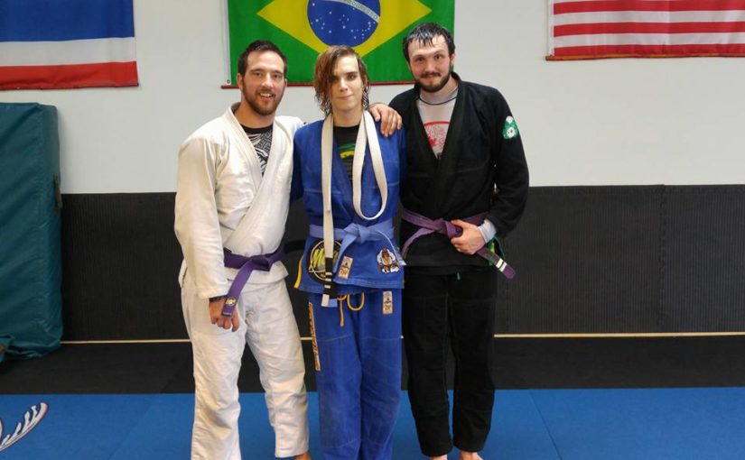 Three judokas standing together.
